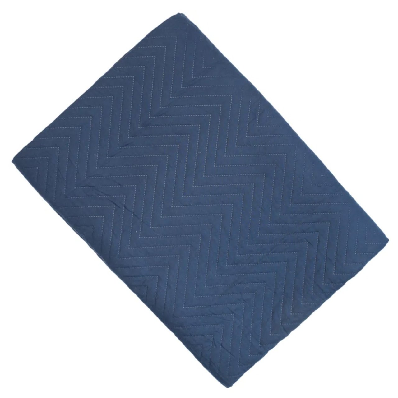 The folded Amelle quilt in navy blue hue featuring a chevron design