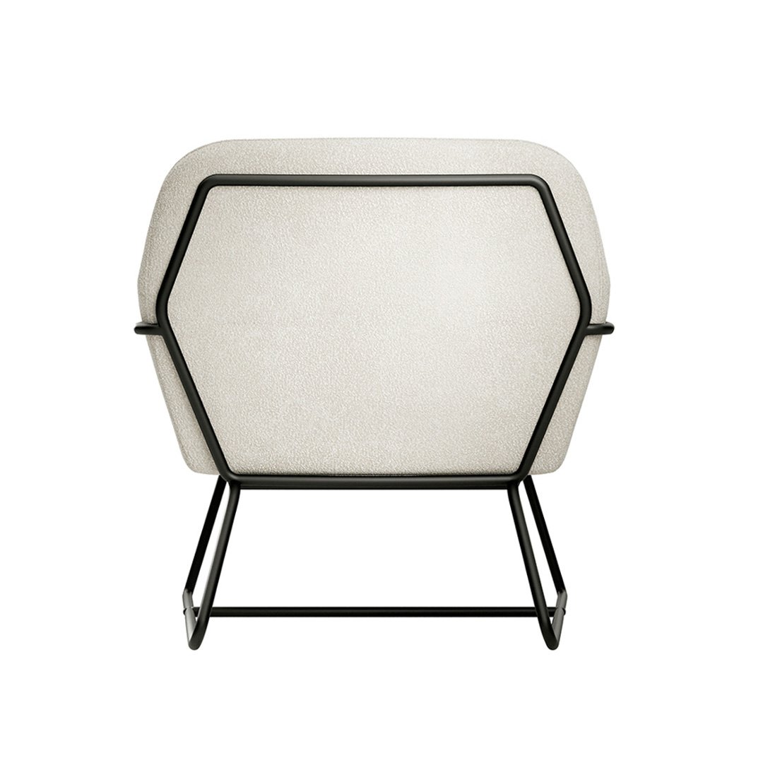 Rear view of the Charlie occasional chair and the contrast of the black outer frame  with the white fabric