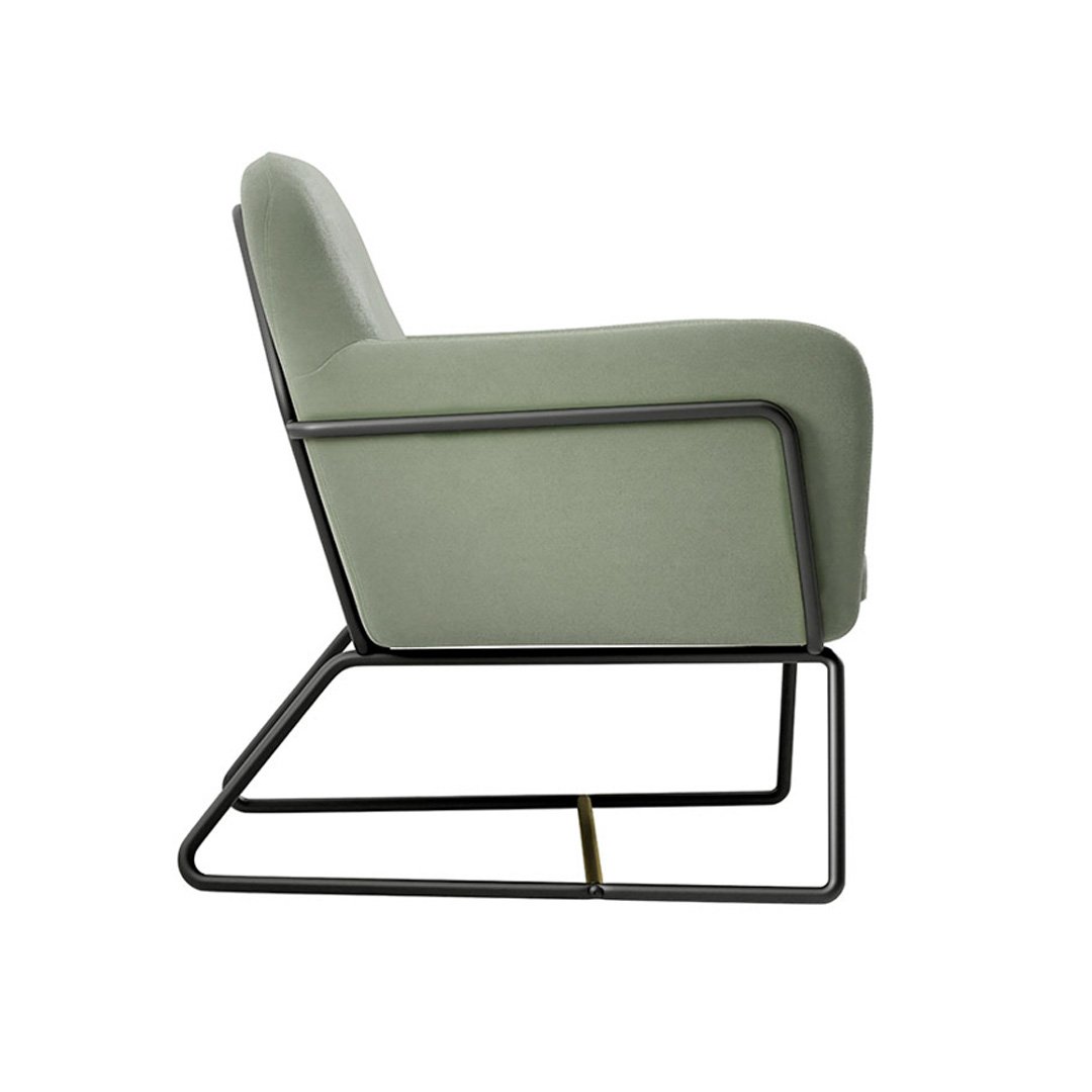 Side profile of the armchair showing its comfy ergonomic design