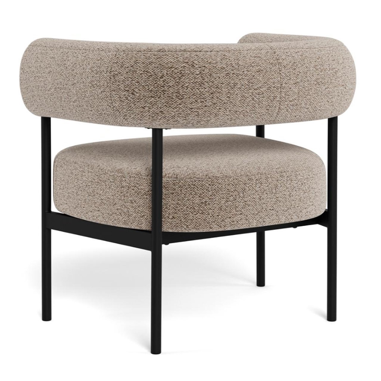 Angled view from the back of the armchair showing off its seamless design and carefully stitched fabric