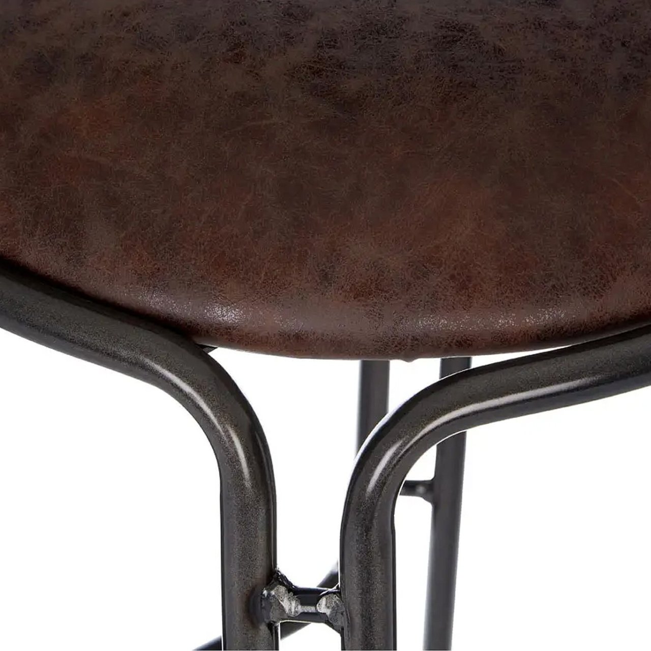 Close up of the edge of the seat and its seamless connection to the frame of the bar stool.  Details of the faux leather can be seen