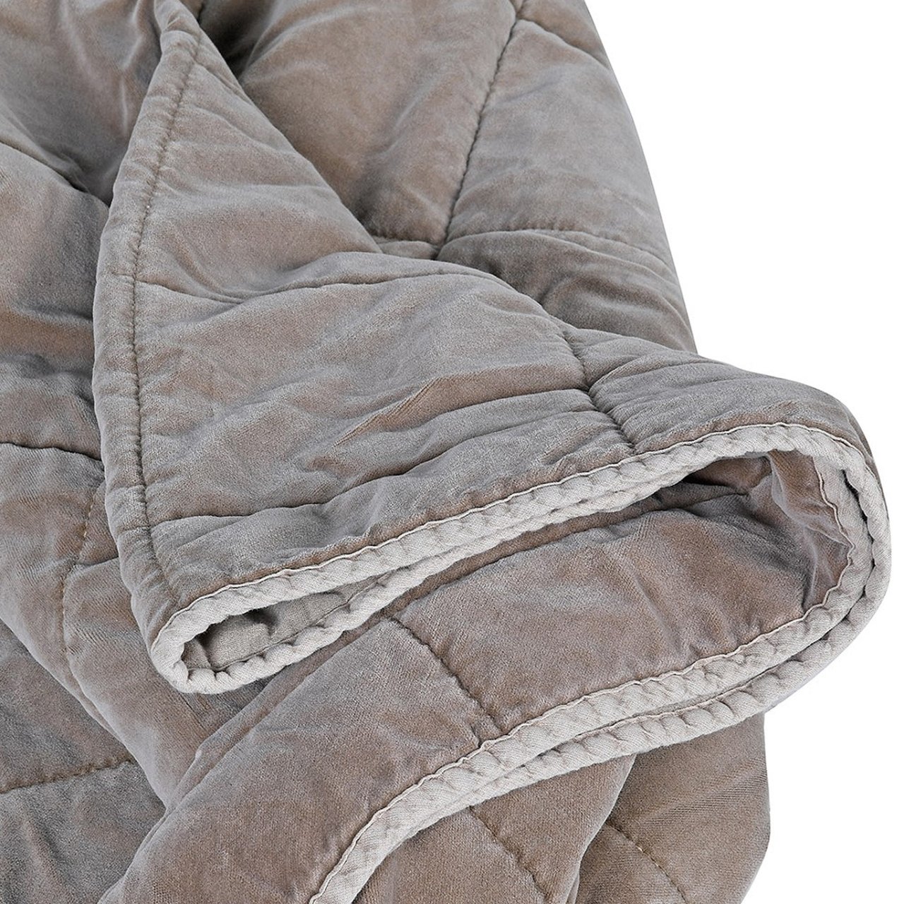 Zoom in on the taupe quilt showing off the stitching and softness of the fabric