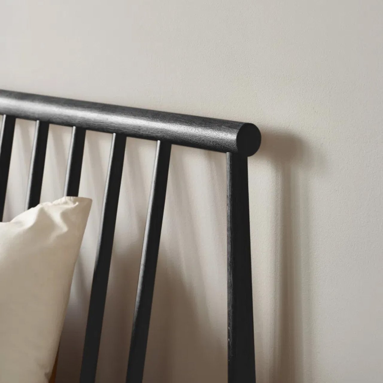 Top right corner of the spindle bed and its spindly headboard