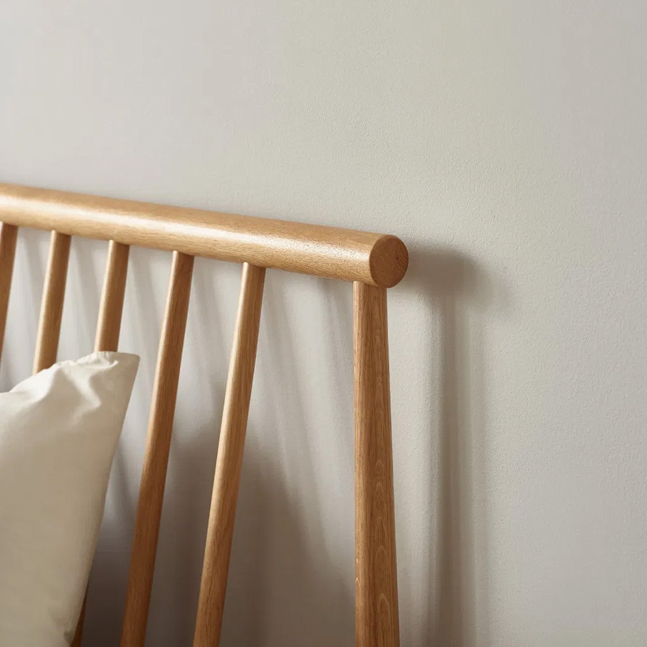 Focus on the spindles and how they go forward from the bedframe creating an angle.