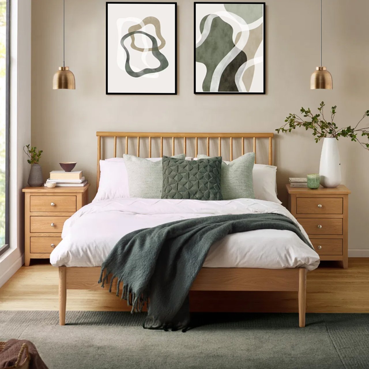 Lifestyle shot of the spindle bed in a modern bedroom among other oak furniture