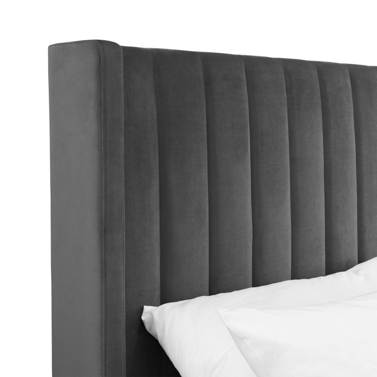 Focus on the grey headboard of the Langi Double bed showing the sectioned off cushioning and the neat stitching at the wings of the piece