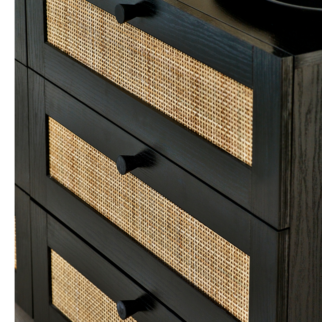 Close up view of the drawers showing the intricate rattan detail and the black round handles, smooth against the natural woodgrain veneer