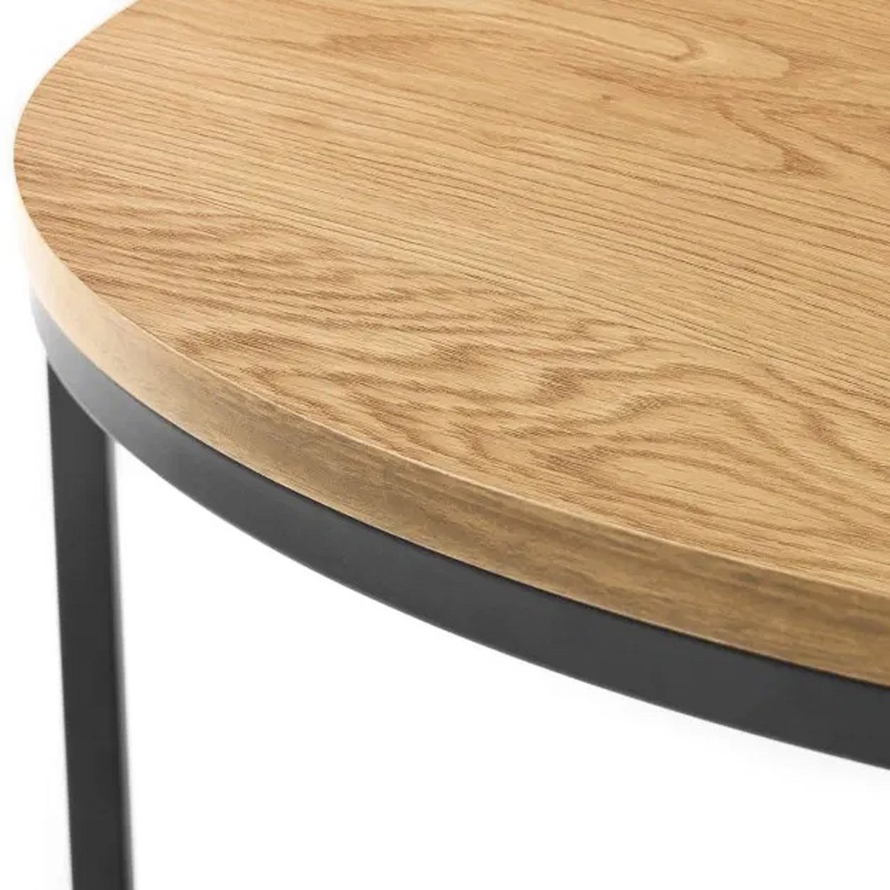 Close up of the top of the large coffee table showcasing the bright oak veneer and the metal legs and frame