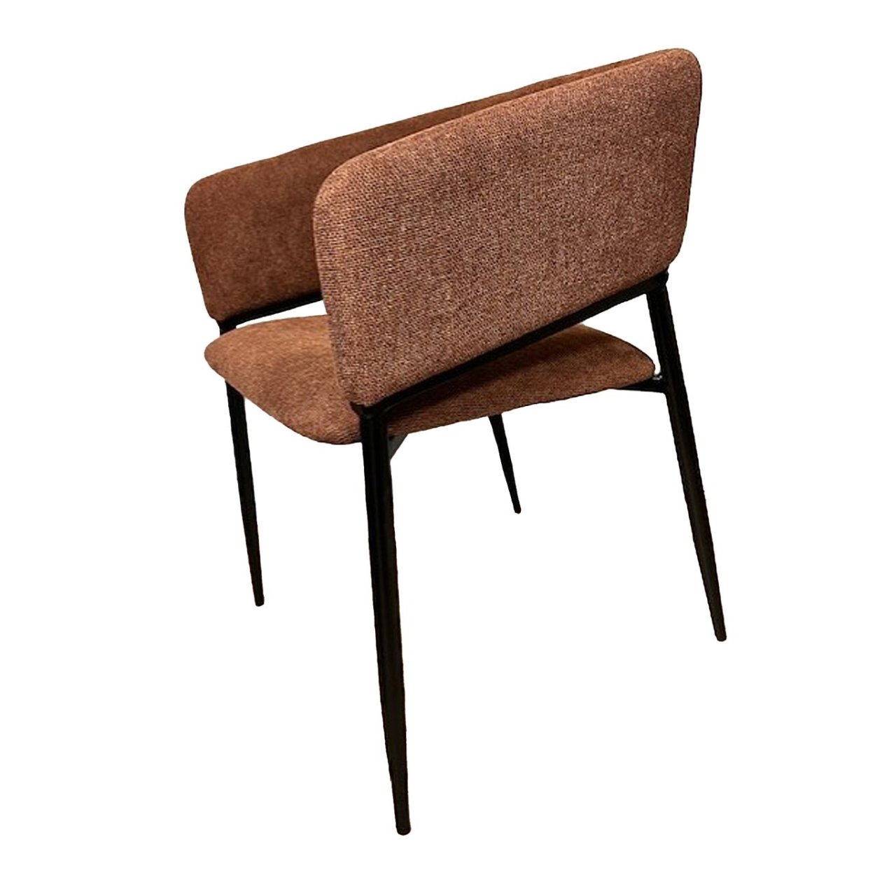 Side view of the curved terracotta dining chair showing its black metal frame and how it supports the backrest, curving with it to meet the back legs