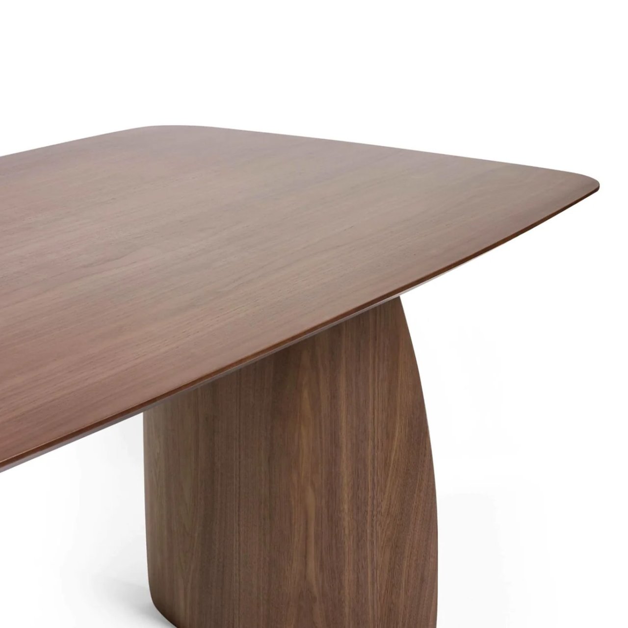 Zoom in on the top of the table with the curved leg in view as well. the walnut surface is smooth and features light woodgrain detailing