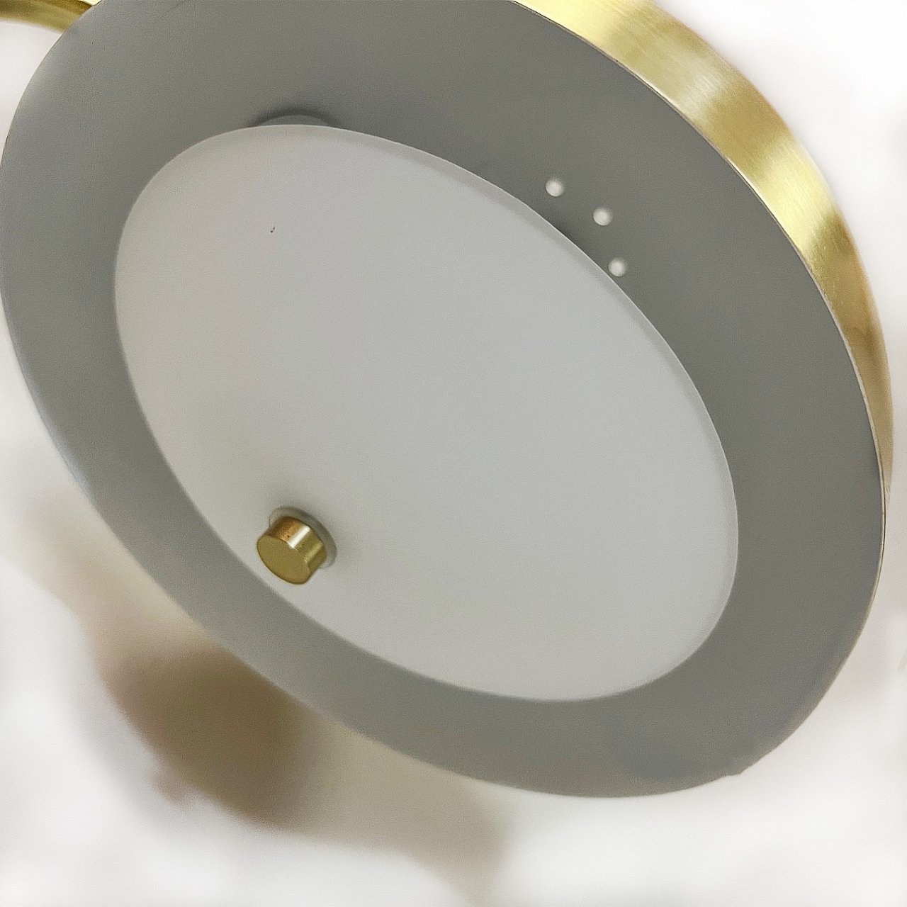 Angled view of the underside of the floor lamp's shade showing the soft translucent inner shade