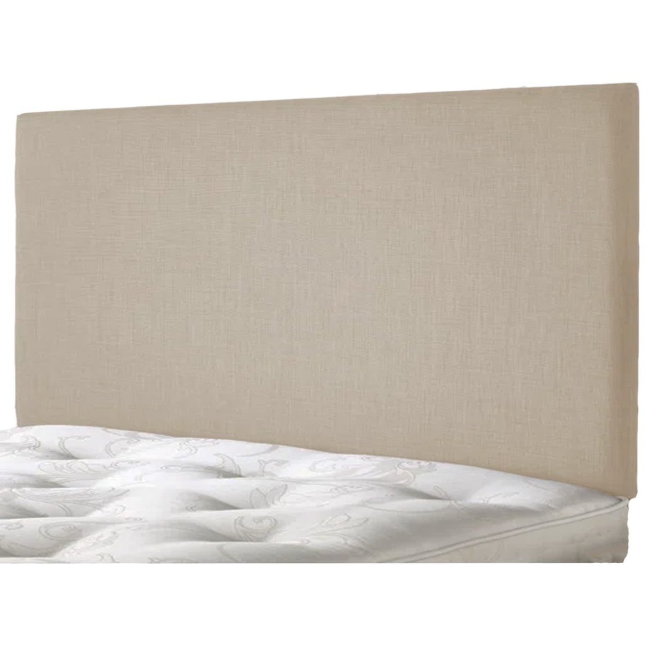 Angled view of the creamy rectangular headboard attached to a bed