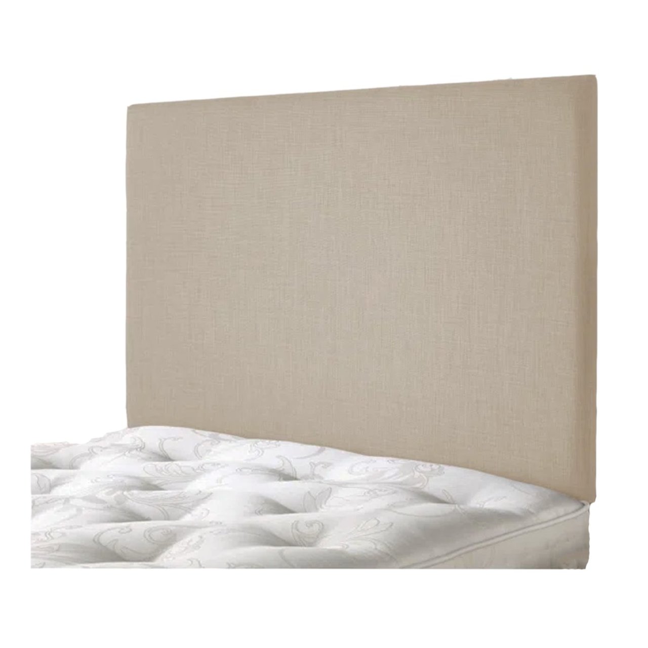Agnled view of the creamy vanilla upholstered headboard attached to a bed