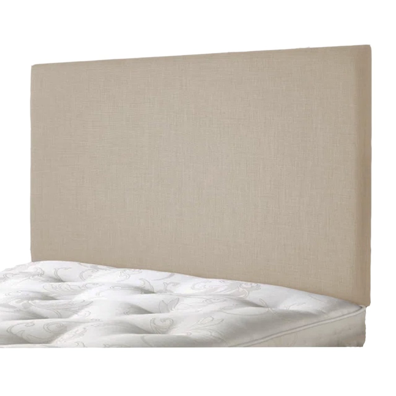 Angled view of the vanilla headboard attached to a bed