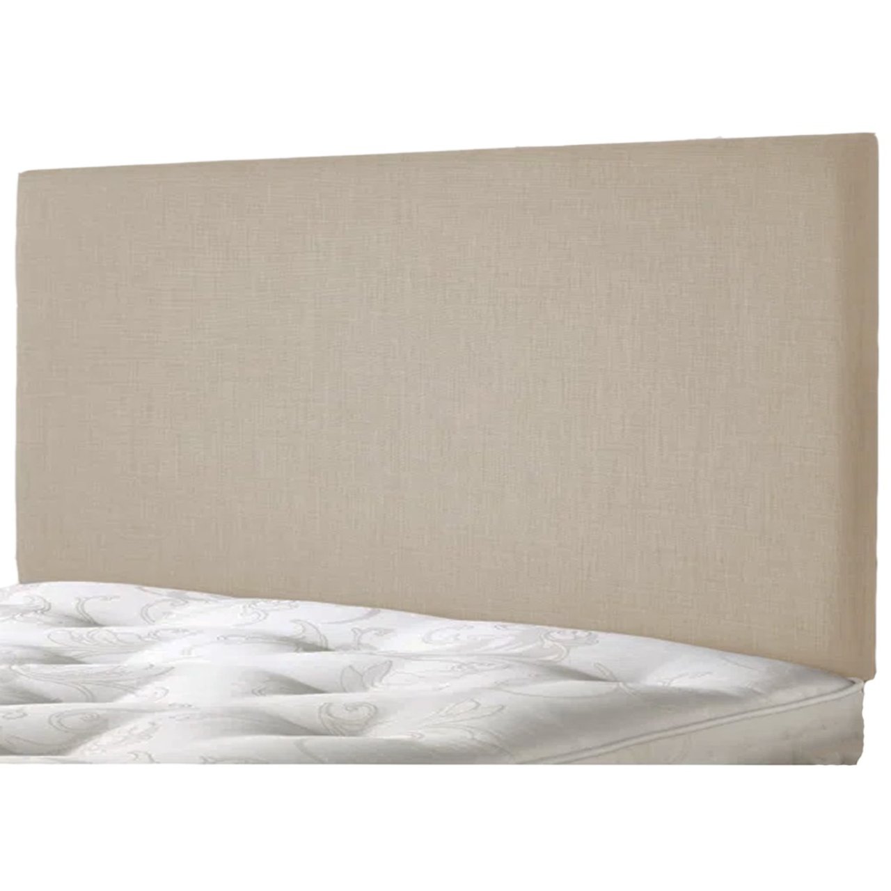 Angled view of the vanilla headboard attached to a bed