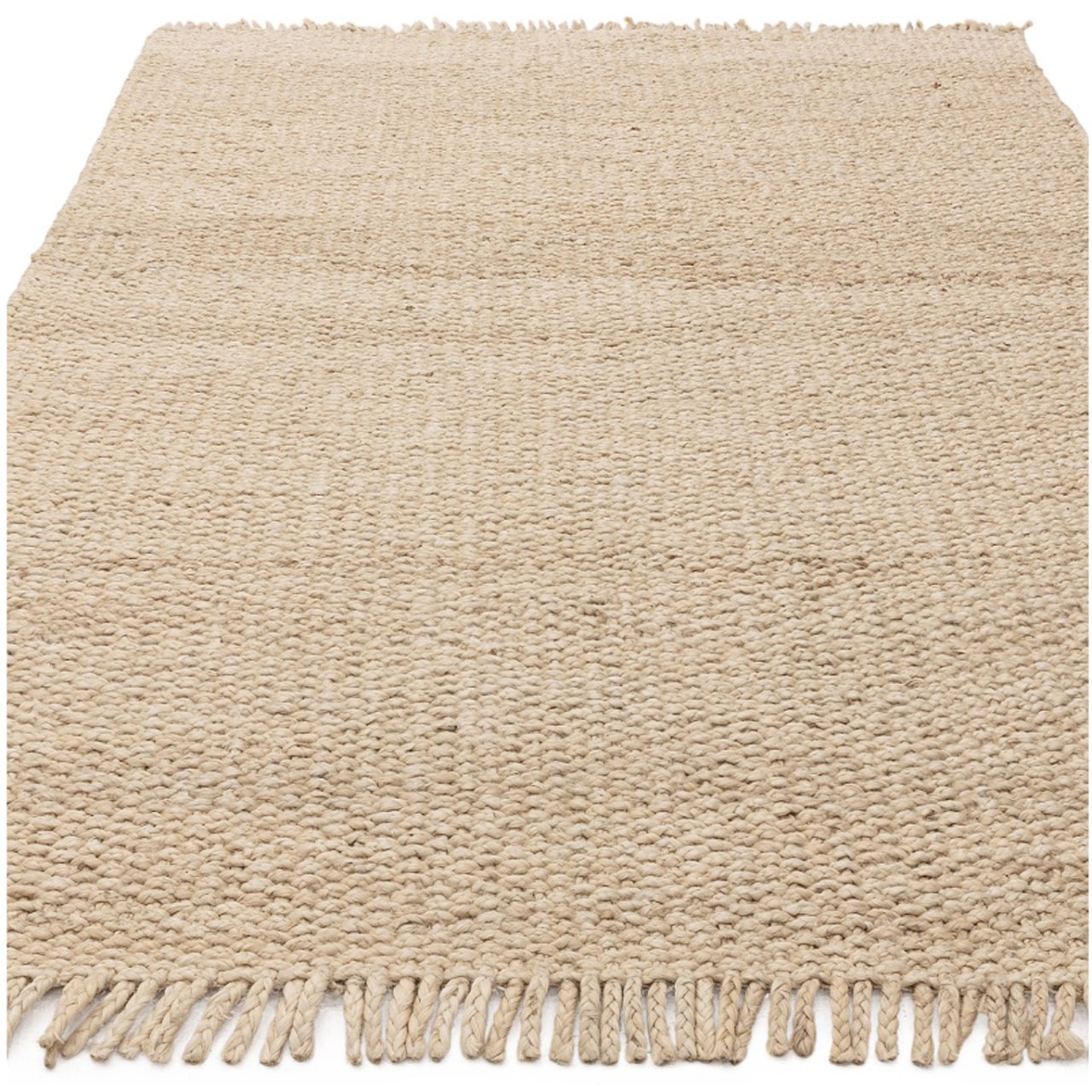 Hand woven rug in sand colour in prone position
