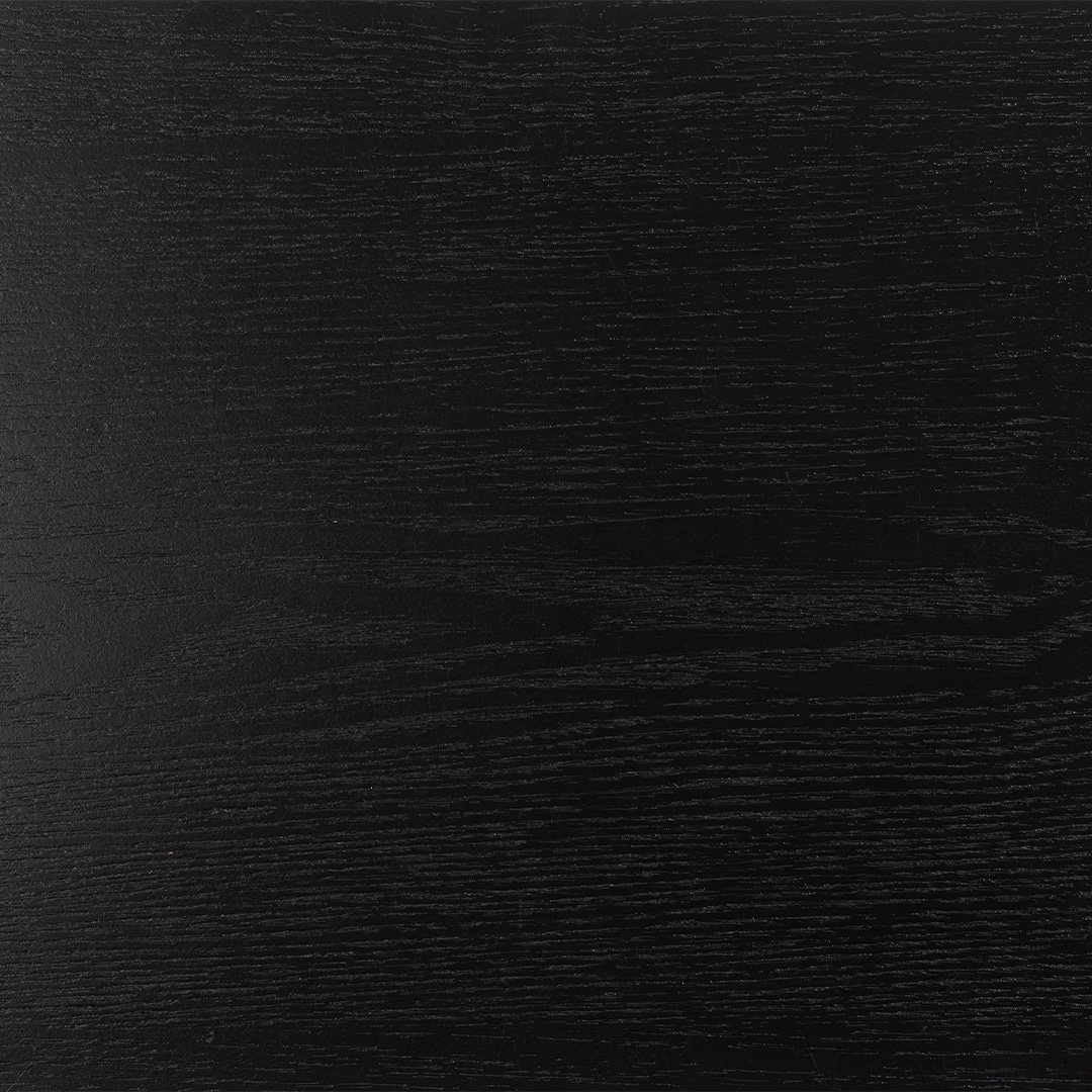 The swatch of the top of the See Lamp table in black ash veneer