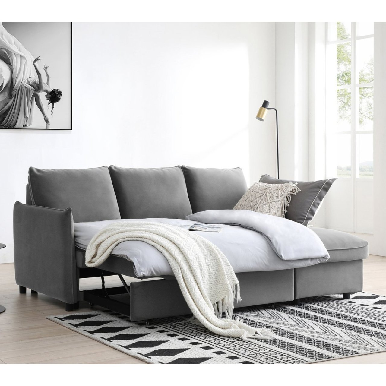 Lifestyle shot of the pulled out Blake sofa bed with a thick duvet on top