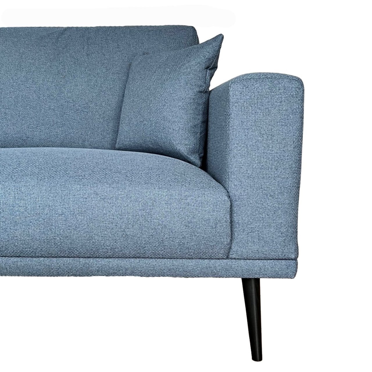 Partial view of the Connie 2 seat blue sofa with a close up of the fabric and clean stitching of the piece