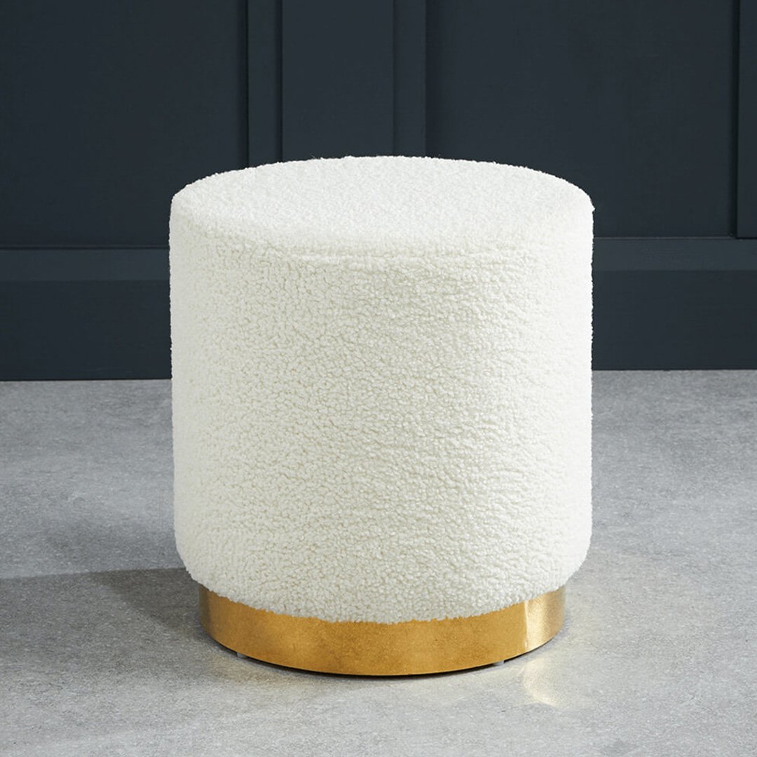 Lifestyle shot of the Lola stool with gold base and boucle fabric