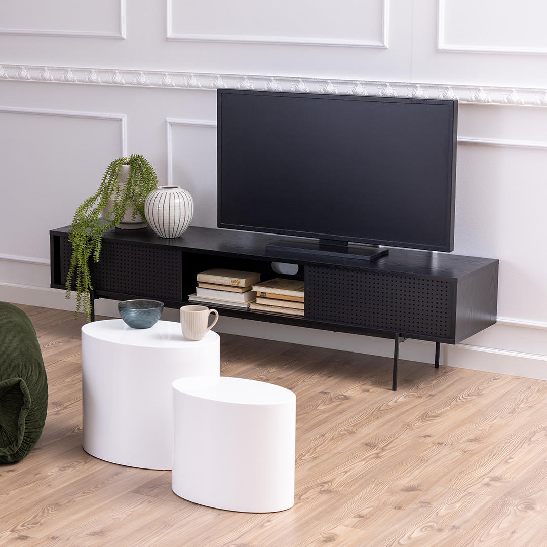 Lifestyle shot of  the TV Unit with a TV and accessories on it in a modern living room