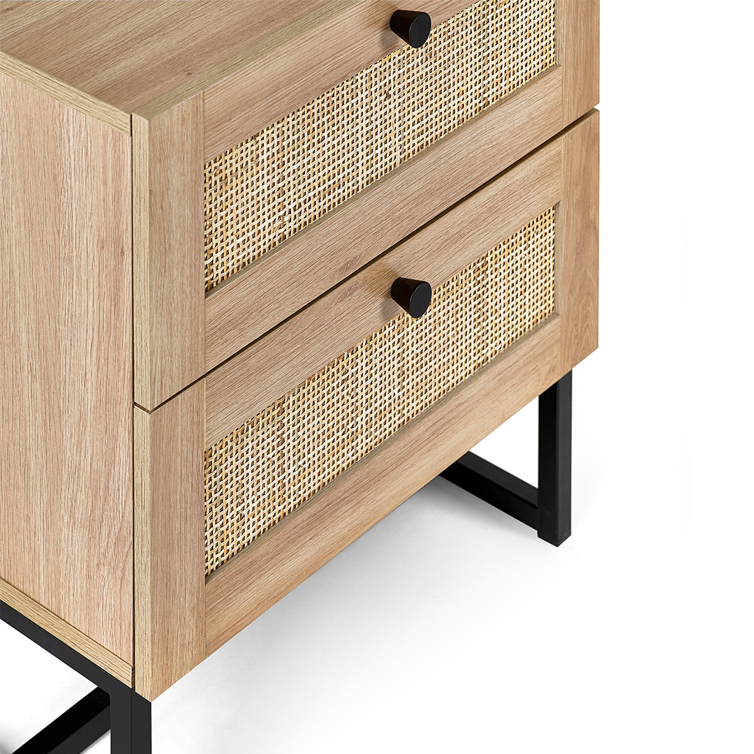 Close up of the black handles and rattan effect of the oak bedside