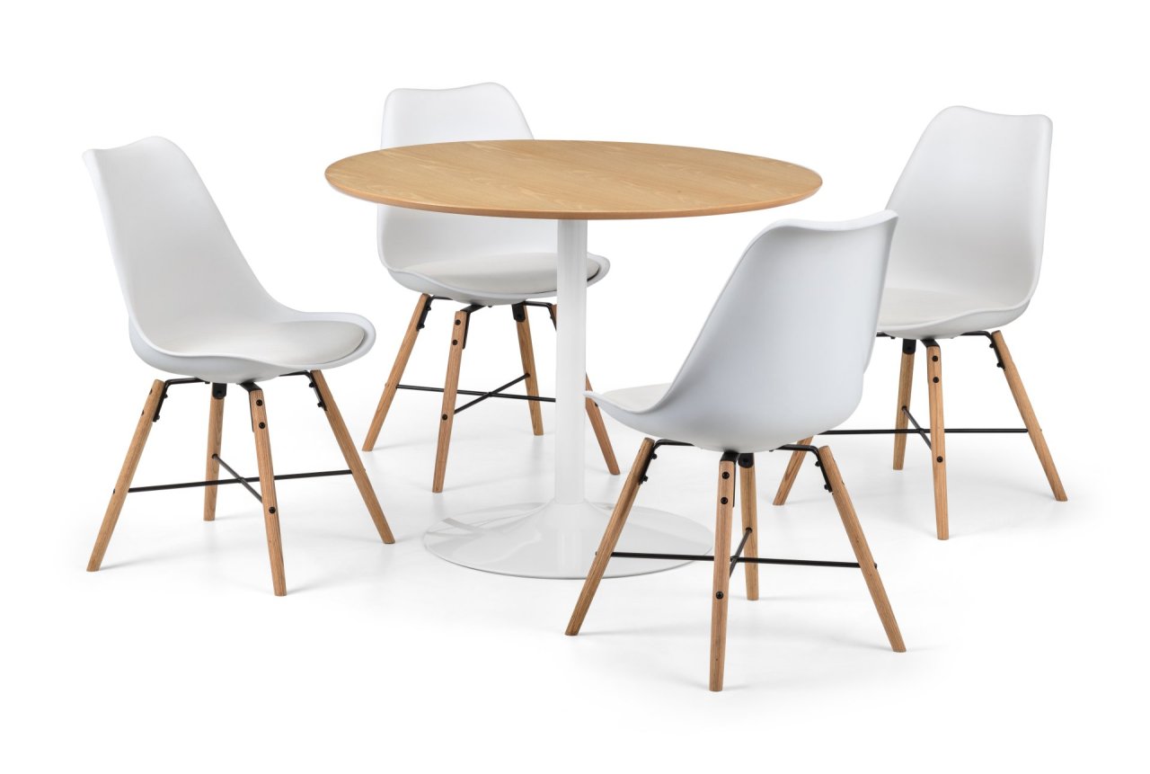 The round table with four white and oak dining chairs in circle around it