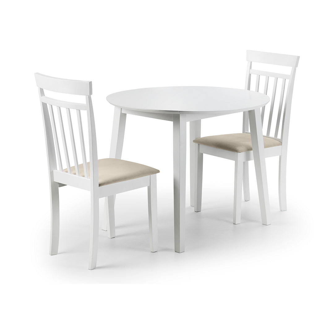 The table with two white dining chairs