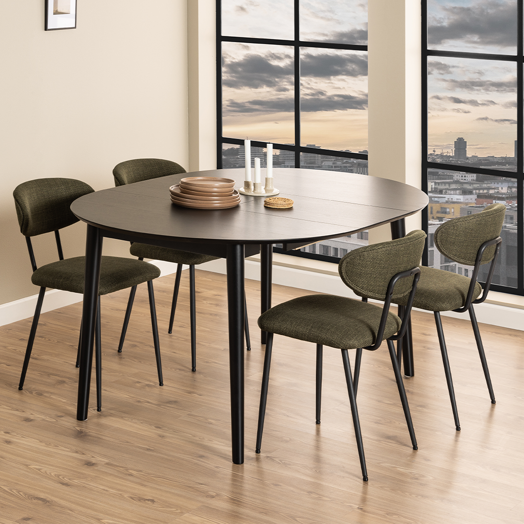 Lifestyle shot of the extended dining table with 4 chairs around it