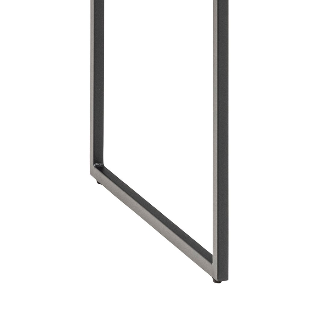 The rectangular metal legs of the desk